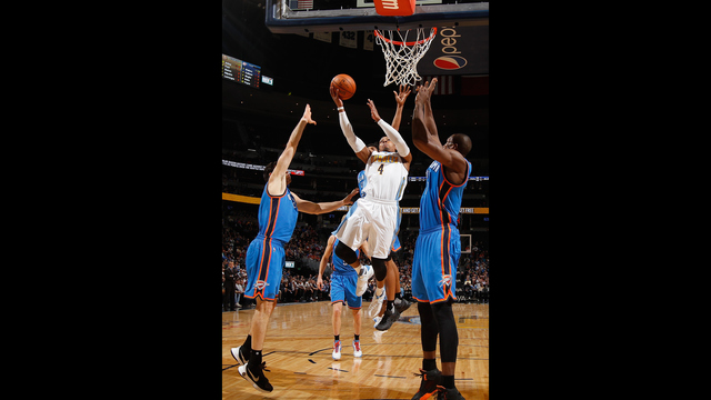 DENVER CO- JANUARY 19 Randy Foye #4 of the Denver Nuggets lays up a shot against the Oklahoma City Thunder at Pepsi Center