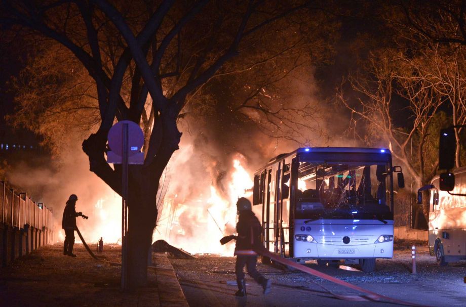 Firefighters work at a scene of fire from an explosion in Ankara Wednesday Feb. 17 2016. A large explosion believed to have been caused by a bomb injured several people in the Turkish capital on Wednesday according to media reports. TUR