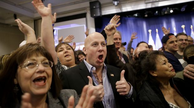 Angry voters align with Trump camp Supporters cheer during a caucus night rally for Donald Trump