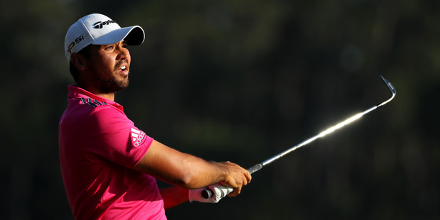 Jason Day plays a shot on the 18th during the final round of THE PLAYERS Championship