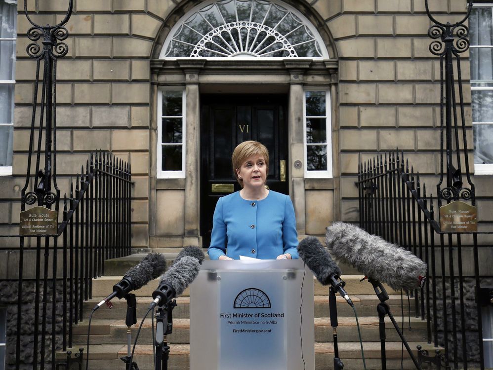 First Minister Nicola Sturgeon speaks to the media outside Bute House following an emergency Scottish cabinet meeting in Edinburgh Scotland Saturday