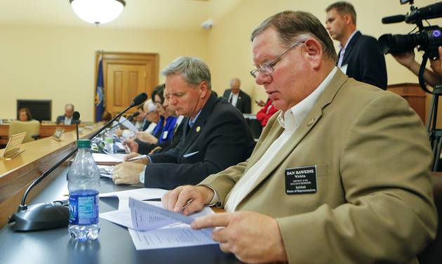 State Rep. Dan Hawkins R-Wichita along with the Kansas House Appropriations Committee looks over their new school finance plan. Friday