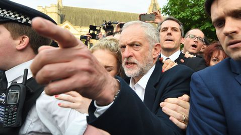 Jeremy Corbyn was defiant as he arrived to talk to supporters in Parliament Square outside the Houses of Parliament in London yesterday