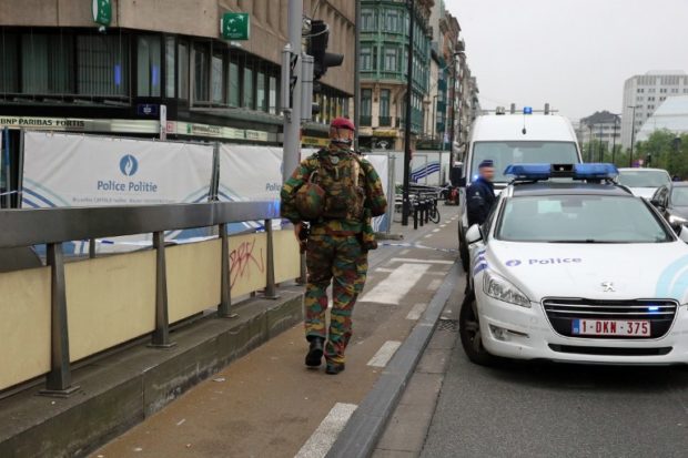 Police and military personnel patrol on the scene of a bomb alert in the City 2 shopping mall in the Rue Neuve in the center of Brussels