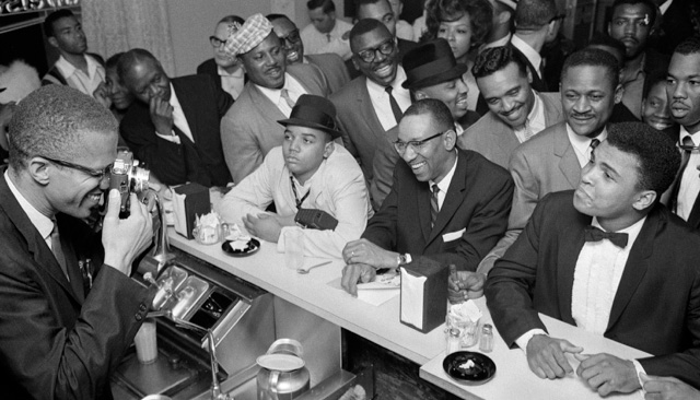 Muhammad Ali shares a moment with his mentor Malcolm X in this historic