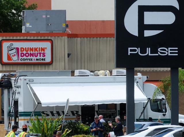 Orlando police officers seen outside of Pulse nightclub after a fatal shooting and hostage situation