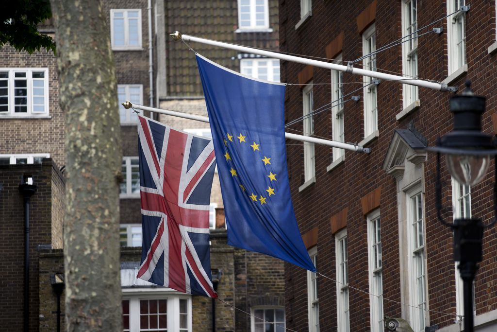 A European Union right and Union flags are displayed outside Europe House the European Parliament's British offices in London Wednesday