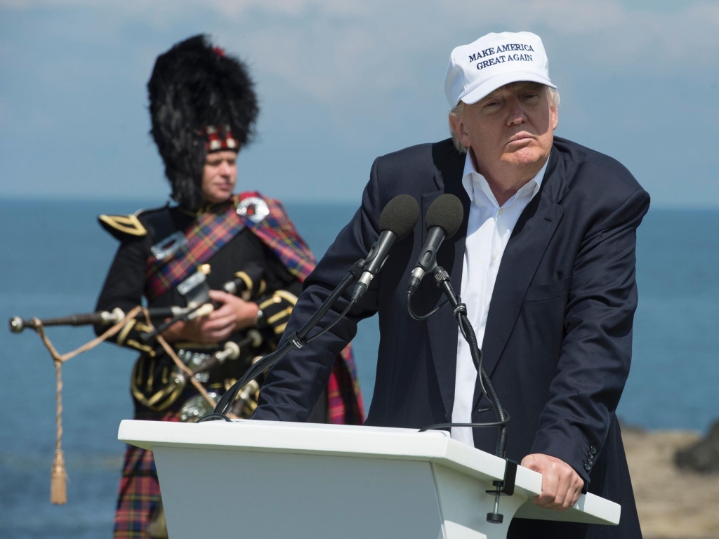 Donald Trump delivers a speech as he officially opens his Trump Turnberry hotel and golf resort in Scotland on Friday. Donald Trump hailed Britain's vote to leave the EU as'fantastic shortly after arriving in Scotland