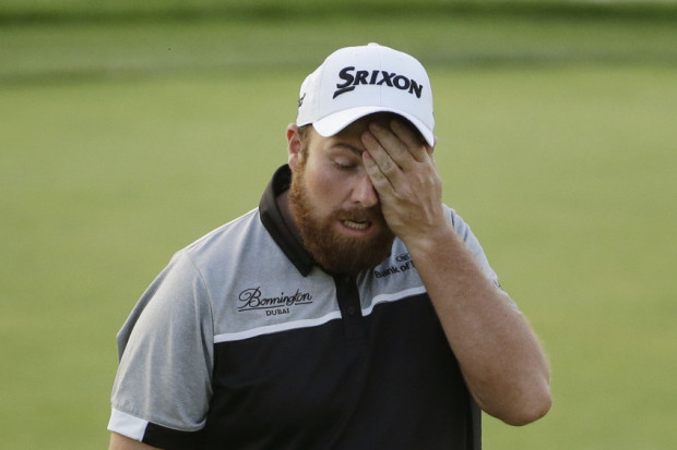 Shane Lowry walks off the 18th green after the final round of the U.S. Open