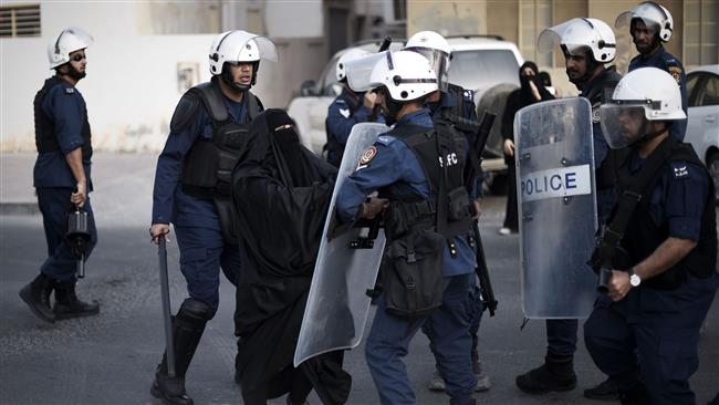 Bahraini woman clashes with riot policemen in the village of Jidhafs west of Manama