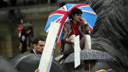 Demonstrators take part in a protest aimed at showing London's solidarity with the European Union following the recent EU referendum in Trafalgar Square central London Britain