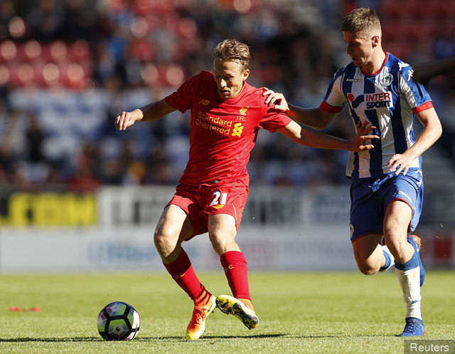 Liverpool's Lucas Leiva in action with Wigan's Jason Pearce