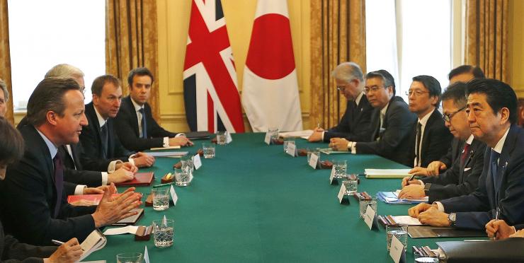 Britain's Prime Minister David Cameron left speaks to Japan's Prime Minister Shinzo Abe as they meet at 10 Downing Street in London Britain Thursday