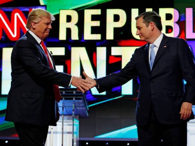 Donald Trump and Ted Cruz shake hands at the start of the Republican candidates debate sponsored by CNN at the University of Miami in Miami Florida