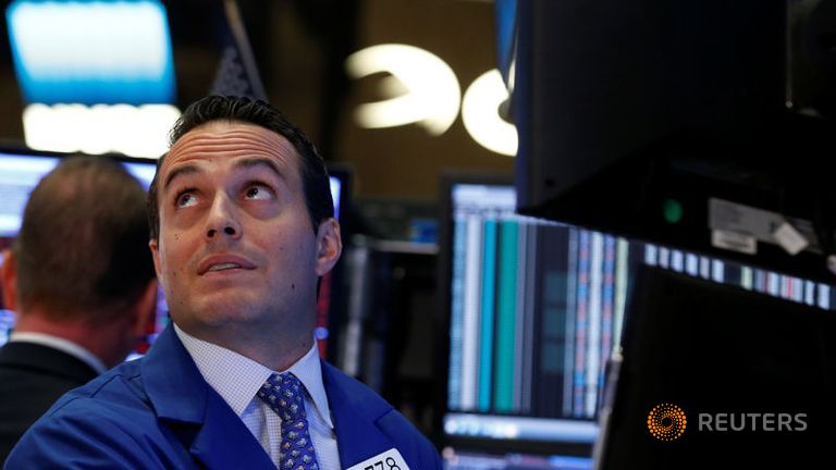 Traders work on the floor of the New York Stock Exchange in New York City U.S