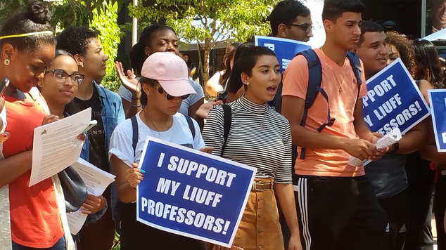 Students at the Long Island University campus in the Brooklyn borough of New York picket outside the college in support of their instructors Tuesday Sept