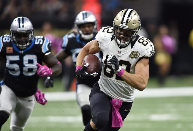 New Orleans Saints tight end Coby Fleener runs to the end zone in front of Carolina Panthers outside linebacker Thomas Davis on a touchdown reception in the second half of an NFL football game in New Orleans Sunday Oct. 16 2016. (AP