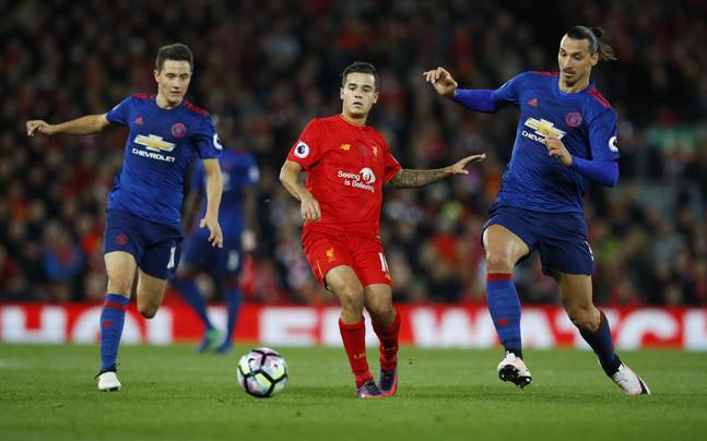 Liverpool and Manchester United players in action