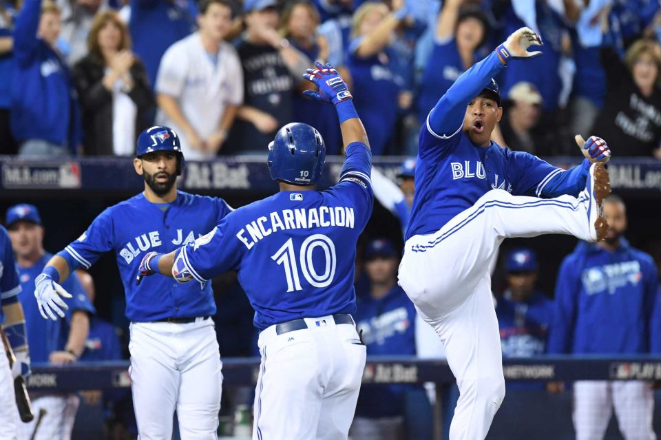 Toronto Blue Jays Edwin Encarnacion celebrates with