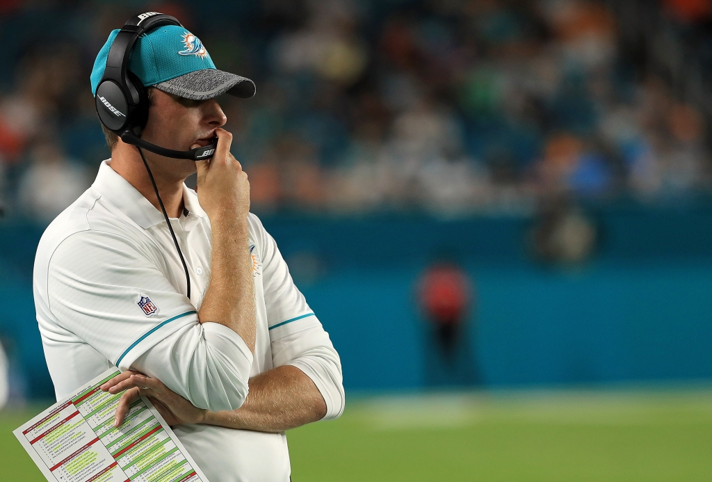 MIAMI GARDENS FL- SEPTEMBER 01 Head coach Adam Gase of the Miami Dolphins looks on during a preseason game against the Tennessee Titans at Hard Rock Stadium