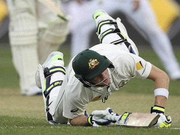 Australia's Steven Smith dives back to his crease during an attempted run out during their cricket test match against South Africa in Hobart