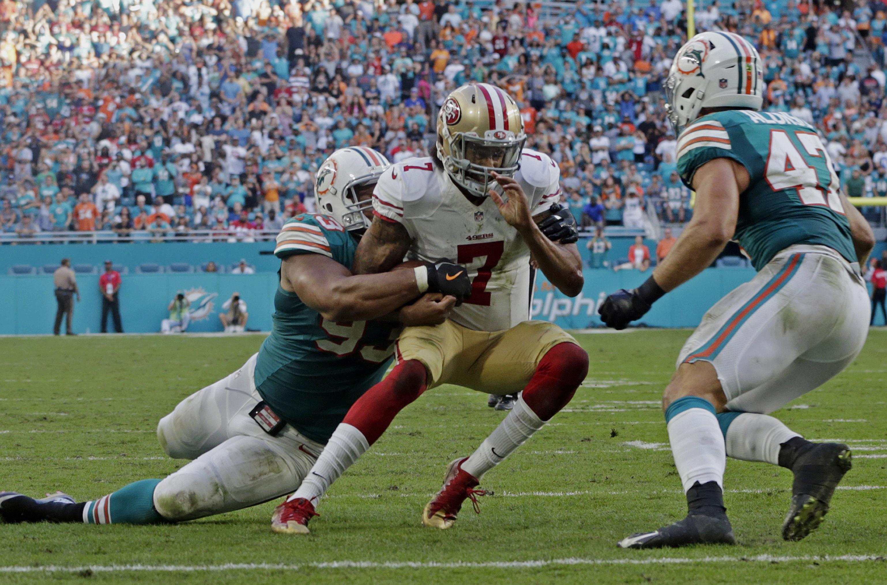 49ers quarterback Colin Kaepernick came up short when tackled by Miami Dolphins defensive tackle Ndamukong Suh, then found plenty to talk about after the game