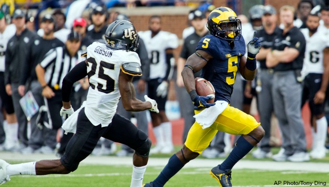 Michigan linebacker Jabrill Peppers, defended by Central Florida defensive back Kyle Gibson, returns a kick off in the second quarter of an NCAA college football game at Michigan Stadium in Ann Arbor Mich. Saturday Sept. 10 2016