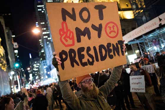 CLEAR AS CRYSTAL Anti Donald Trump protesters march on Fifth Avenue in New York City on late Friday. AFP