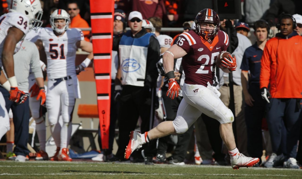 Virginia Tech fullback Sam Rogers heads to the end zone for a touchdown during the first half of an NCAA college football game against Virginia in Blacksburg Va. Saturday Nov. 26 2016