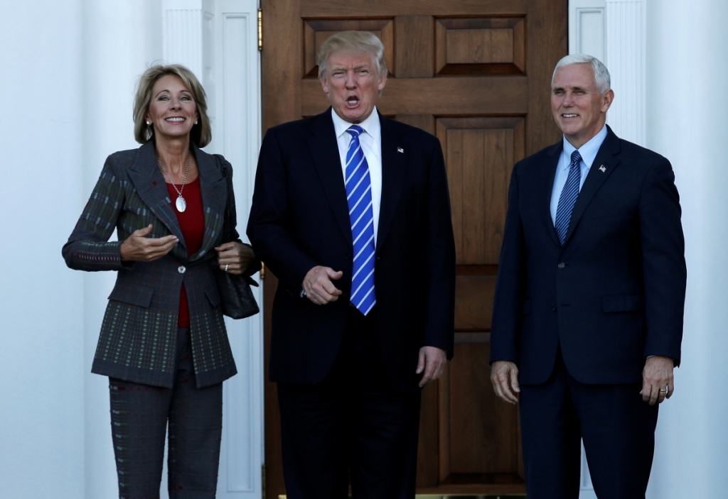 Donald Trump and Vice President-elect Mike Pence with Betsy De Vos at Trump National Golf Club in Bedminster New