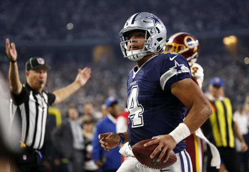 Cowboys notch 10th straight win, edge Redskins 31-26