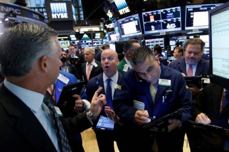 Wall Street closes in on record high