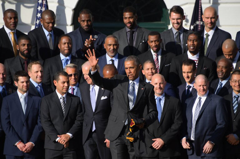 US President Barack Obama waves to the crowd during an event with the 2016 NBA Championship