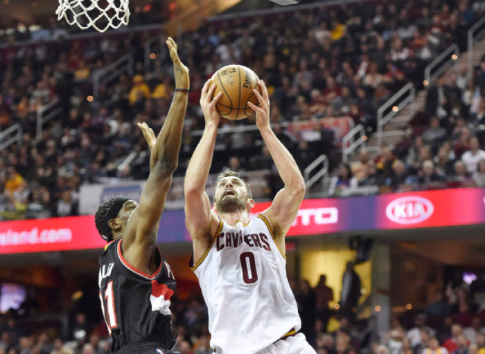 Cleveland Cavaliers’ forward Kevin Love shoots against Portland Trail Blazers’ forward Meyers Leonard during their NBA game at Quicken Loans Arena in Cleveland Wednesday. — Reuters