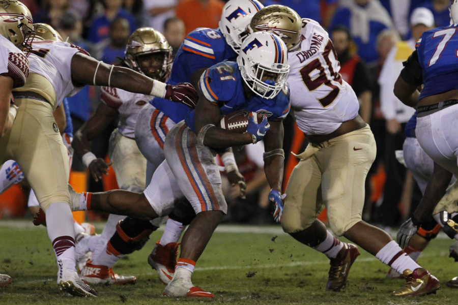 28 November 2015 Florida Gators running back Kelvin Taylor runs the ball during the NCAA football game between the Florida State Seminoles and the Florida Gators at Ben Hill Griffin Stadium at Florida Field in Gainesville FL