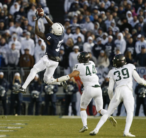 Penn State's Dae Sean Hamilton makes a catch in front of Michigan State's Grayson Miller during the first half of an NCAA college football game in State College Pa. Saturday Nov. 26 2016