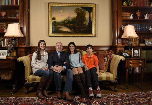 South Carolina Gov. Nikki Haley along with her family husband Michael daughter Rena and son Nalin sit for a portrait in the drawing room of the Governor's Mansion in Columbia S.C. President-elect Donald Trump has chosen Ha