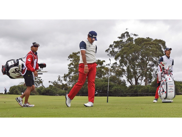 Hideki Matsuyama of Japan drops his club after a wayward shot during the third day of the World Cup of Golf on the Kingston Heath course in Melbourne