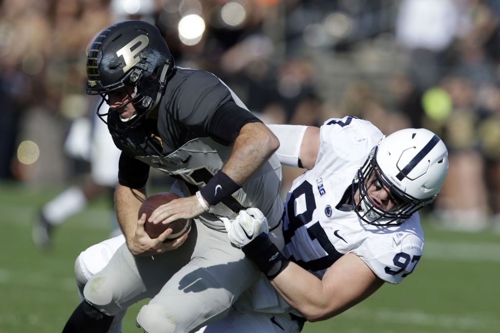 Penn St Purdue Football-1 Penn State defensive end Ryan Buchholz sacks Purdue quarterback David Blough during 62-24 Penn State win against Purdue on Oct. 29