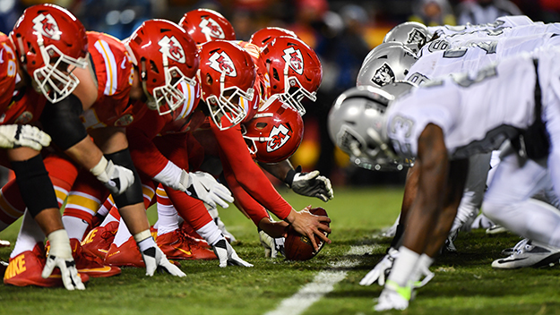 The Kansas City Chiefs and Oakland Raiders line up before a snap during the game at Arrowhead Stadium in Kansas City