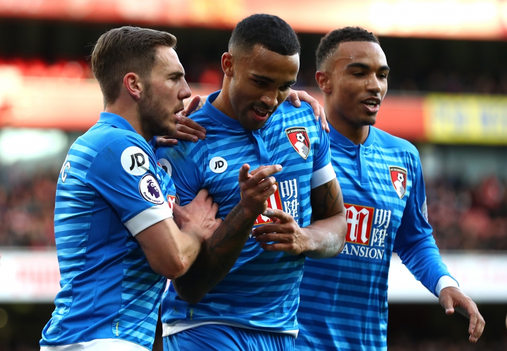 LONDON ENGLAND- NOVEMBER 27 Callum Wilson of AFC Bournemouth celebrates scoring his sides first goal with Dan Gosling of AFC Bournemouth and Junior Stanislas of AFC Bournemouth during the Premier League match between Arsenal and AFC Bournem