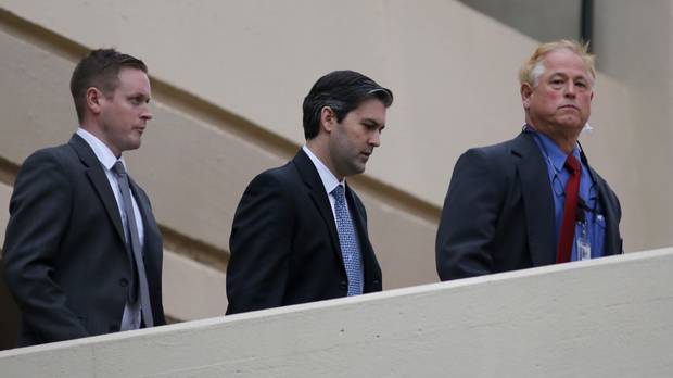 Michael Slager centre walks from Charleston County Courthouse