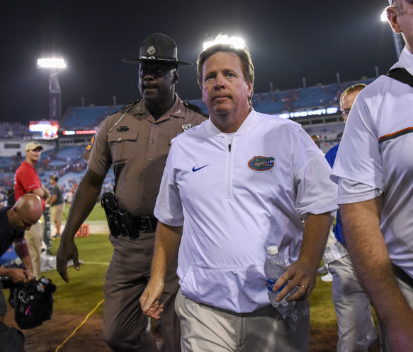 Florida Gators head coach Jim Mc Elwain walks back to the locker room after the game between the Florida Gators and the Georgia Bulldogs at Ever Bank Field in Jacksonville on Oct. 29. Florida beat Georgia 24-10