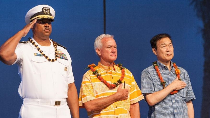 U.S. Navy Read Adm. John Fuller left Honolulu mayor Kirk Caldwell center and then Nagaoka City Mayor Tomio Mori look on during a celebration marking the 70th anniversary of the end of World War II at Joint Base