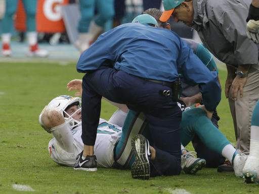 Dolphins' Ryan Tannehill gets emotional after injuring knee on dangerous low hit