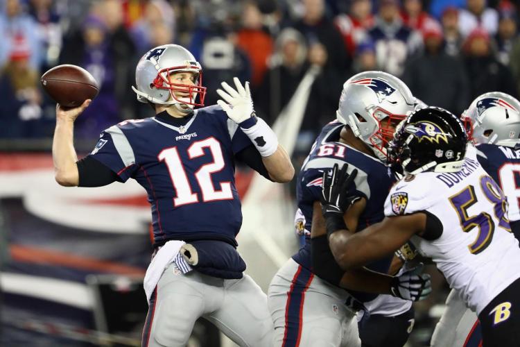 Tom Brady throws for 406 yards and three touchdowns as the Patriots improve to 11-2