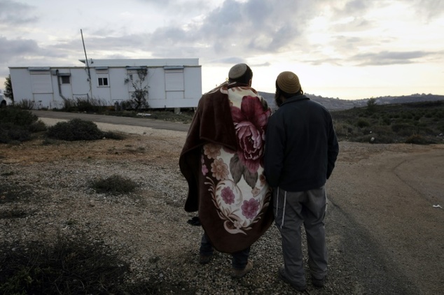 Young Israeli settlers gather in the settlement outpost of Amona in the West Bank