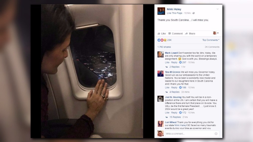 Former South Carolina Governor NIkki Haley looks out an airplane window as she leaves the state