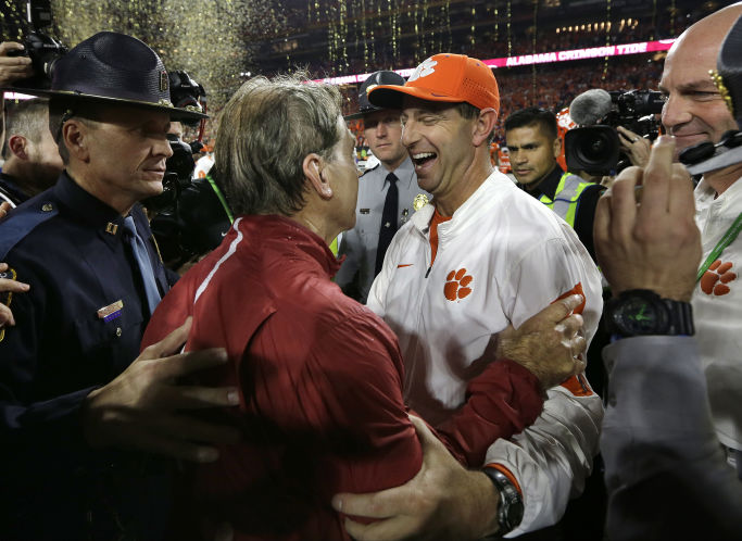 Clemson head coach Dabo Swinney right congratulates Alabama head coach Nick Saban after the NCAA college football playoff championship game in January 2015 in Glendale Ariz. Alabama won 45-40