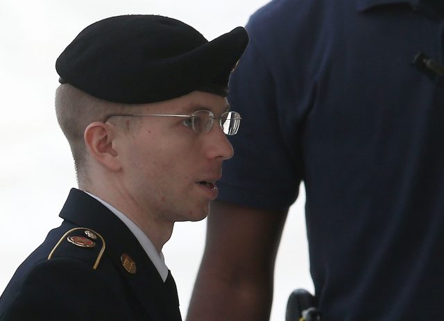 FORT MEADE MD- AUGUST 21 US Army Private First Class Bradley Manning is escorted by military police as he arrives for his sentencing at military court facility for the sentencing phase of his trial